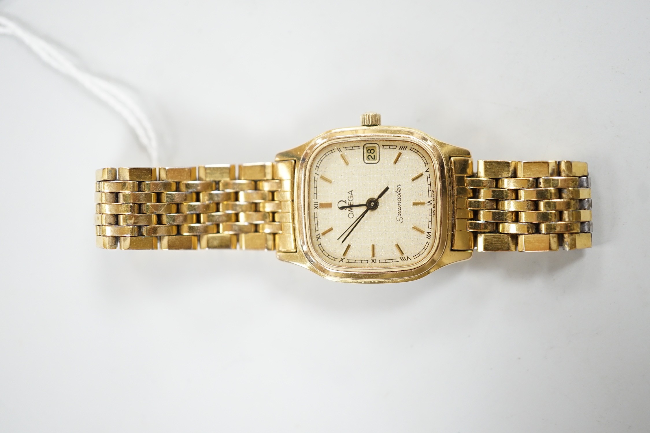 A lady's steel and gold plated Omega Seamaster quartz wrist watch, on an Omega steel and gold plated bracelet.